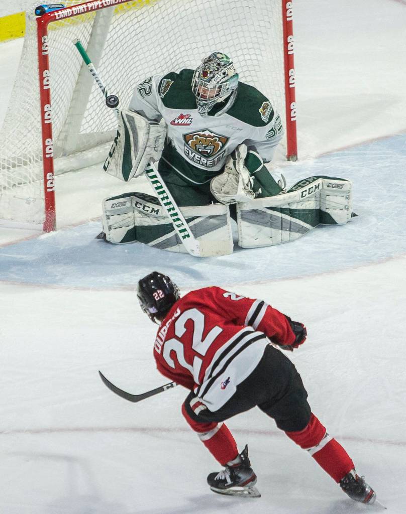 Silvertips Dustin Wolf blocks a shot by Winterhawks Jaydon Dureau during the game against the Portland Winterhawks on Sunday, March 1, 2020 in Everett, Wa. (Olivia Vanni / The Herald)
