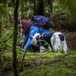 Kristin Rosenbach smiles at Callie as they search the ground where Callie indicated a truffle was present. (Olivia Vanni / The Herald)