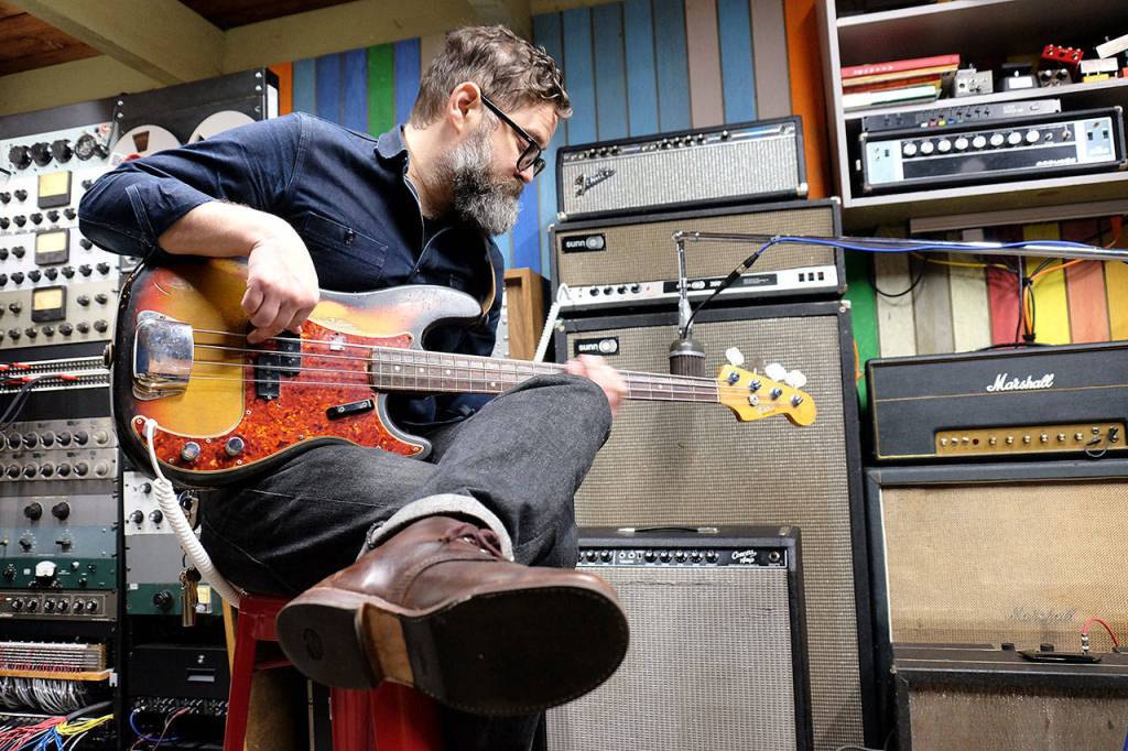 Craig Curran recorded bass riffs into a microphone made in 1939 for the Wolcott Curran Collectives new single, Good Luck With That. (Annie Wolcott)