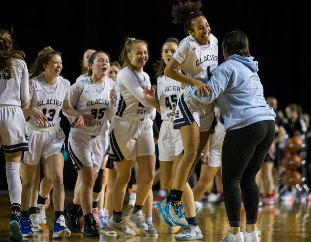 The Glacier Peak team reacts to beating Camas at the Hardwood Classic on Wednesday, March 4, 2020 in Tacoma, Wa. (Olivia Vanni / The Herald)