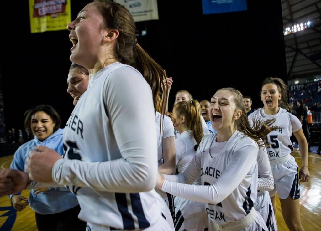 The Glacier Peak team reacts to beating Camas at the Hardwood Classic on Wednesday, March 4, 2020 in Tacoma, Wa. (Olivia Vanni / The Herald)