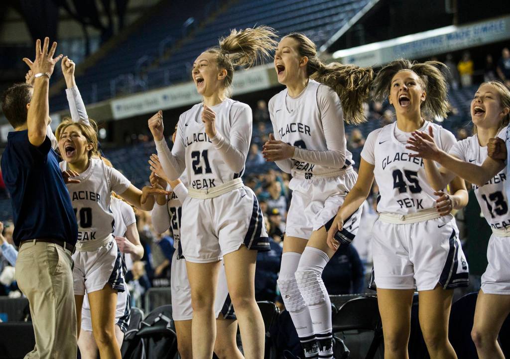 The Glacier Peak bench reacts to Glacier Peaks Aaliyah Collins steal to seal their win against against Camas at the Hardwood Classic on Wednesday, March 4, 2020 in Tacoma , Wa. (Olivia Vanni / The Herald)