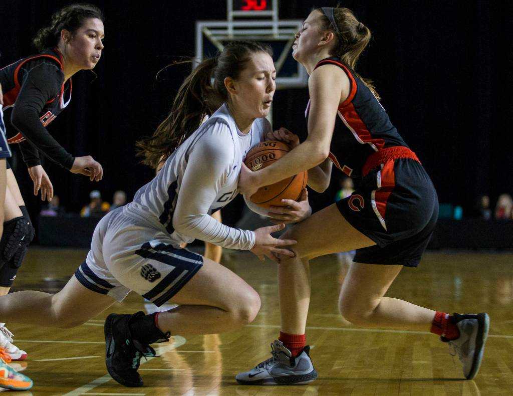 Glacier Peaks Maya Erling scrambles for the ball with Camas Anna Mooney during the game at the Hardwood Classic on Wednesday, March 4, 2020 in Tacoma, Wa. (Olivia Vanni / The Herald)