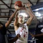 Marysville Pilchucks Aaron Kalab (center) attempts a shot between Central Kitsaps Maurice Green (left) and Jo Jo Johnson (right) during a 3A boys Hardwood Classic game Wednesday morning at the Tacoma Dome. (Kevin Clark / The Herald)