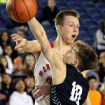 Marysville Pilchucks Luke Dobler makes a pass with Central Kitsaps Colby White defending during a 3A boys Hardwood Classic game Wednesday morning at the Tacoma Dome. (Kevin Clark / The Herald)