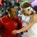 Marysville Pilchuck coach Bary Gould greets Cameron Stordahl after subbing him out of a 3A boys Hardwood Classic game against Central Kitsap Wednesday morning at the Tacoma Dome. (Kevin Clark / The Herald)