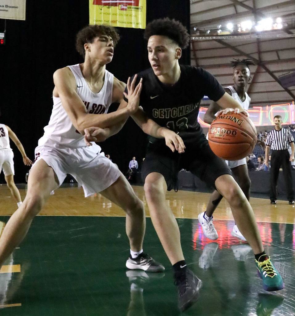 Marysville-Getchells Austin Townsend works the post with Wilsons Jackson Dorsey defending Wednesday morning at the Tacoma Dome on March 4, 2020. Marysville-Gethchell lost to Wilson 73-52. (Kevin Clark / The Herald)
