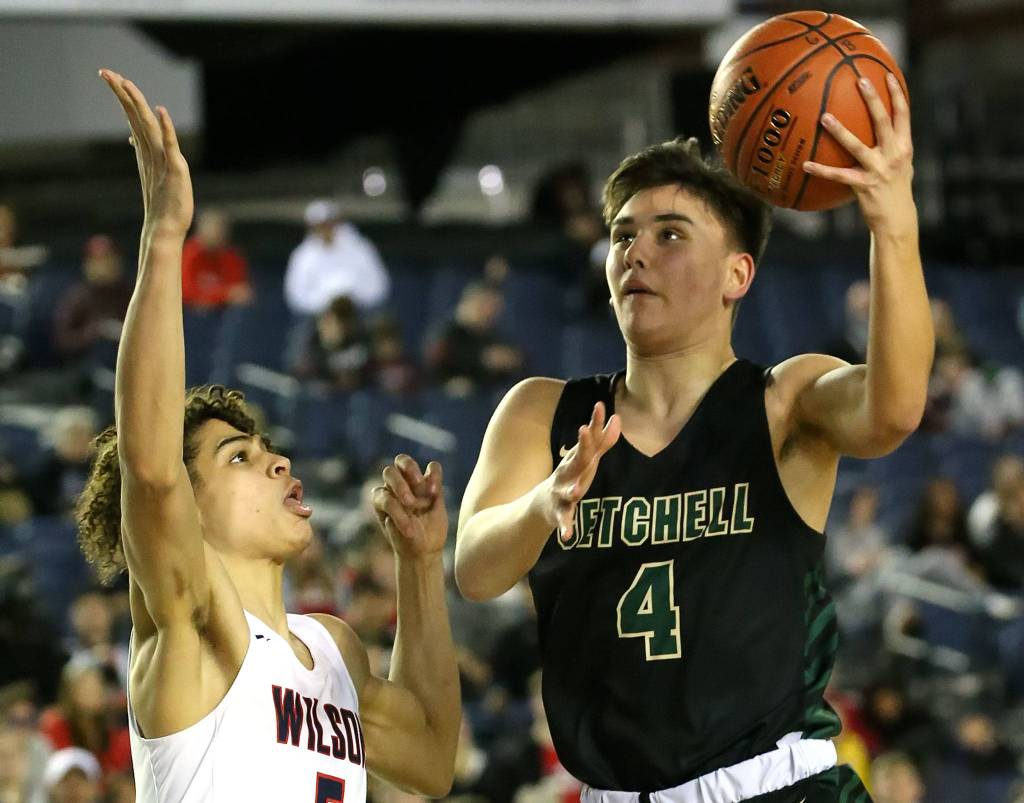 Marysville-Getchells Landyn Olson attempts a shot with Wilsons Jackson Dorsey defending Wednesday morning at the Tacoma Dome on March 4, 2020. Marysville-Gethchell lost to Wilson 73-52. (Kevin Clark / The Herald)