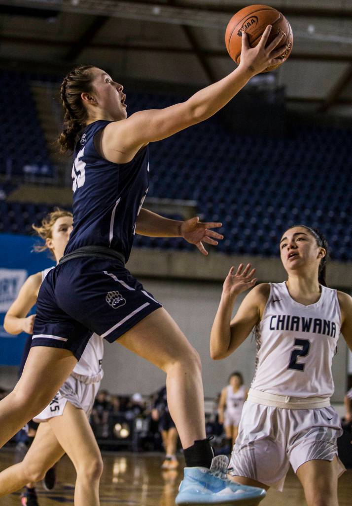 Glacier Peaks Maya Erling attempts a layup over Chiawanas Alyssa Agundis during the quarterfinal game at the Hardwood Classic on Thursday, March 5, 2020 in Tacoma , Wa. (Olivia Vanni / The Herald)
