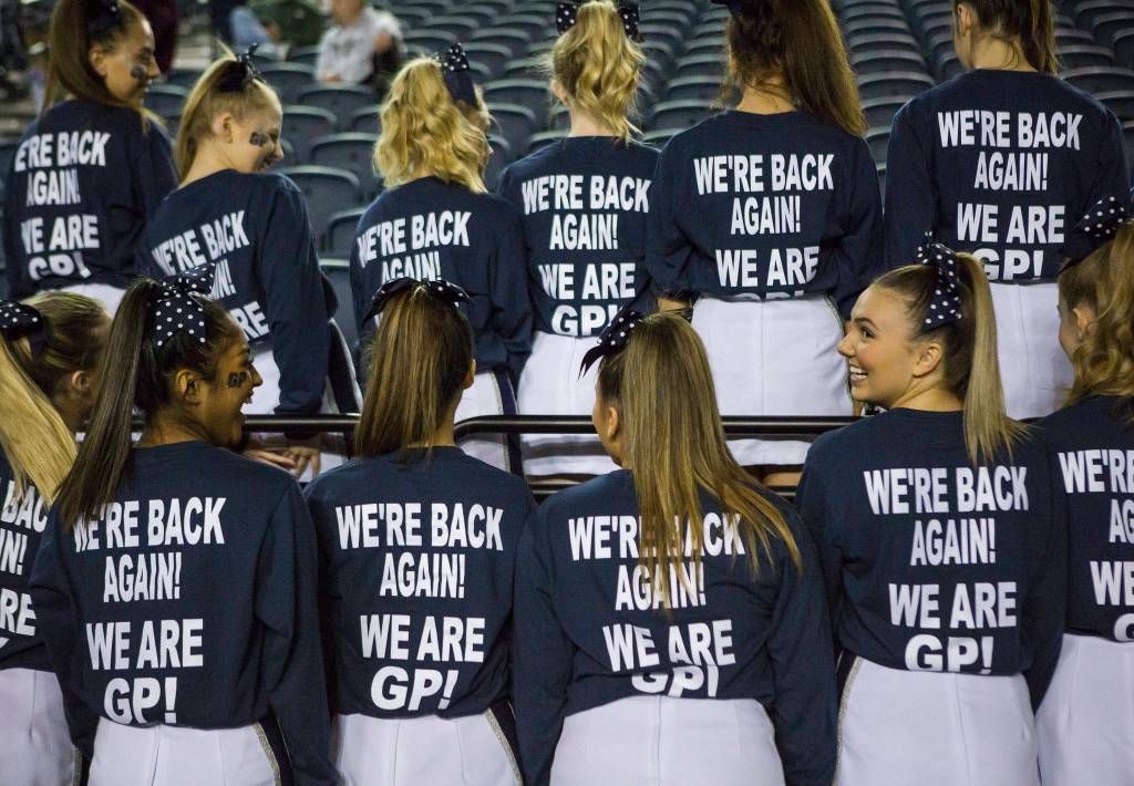 The Glacier Peak cheer team poses for a photo after beating Chiawana to advance to the semifinals at the Hardwood Classic on Thursday, March 5, 2020 in Tacoma , Wa. (Olivia Vanni / The Herald)