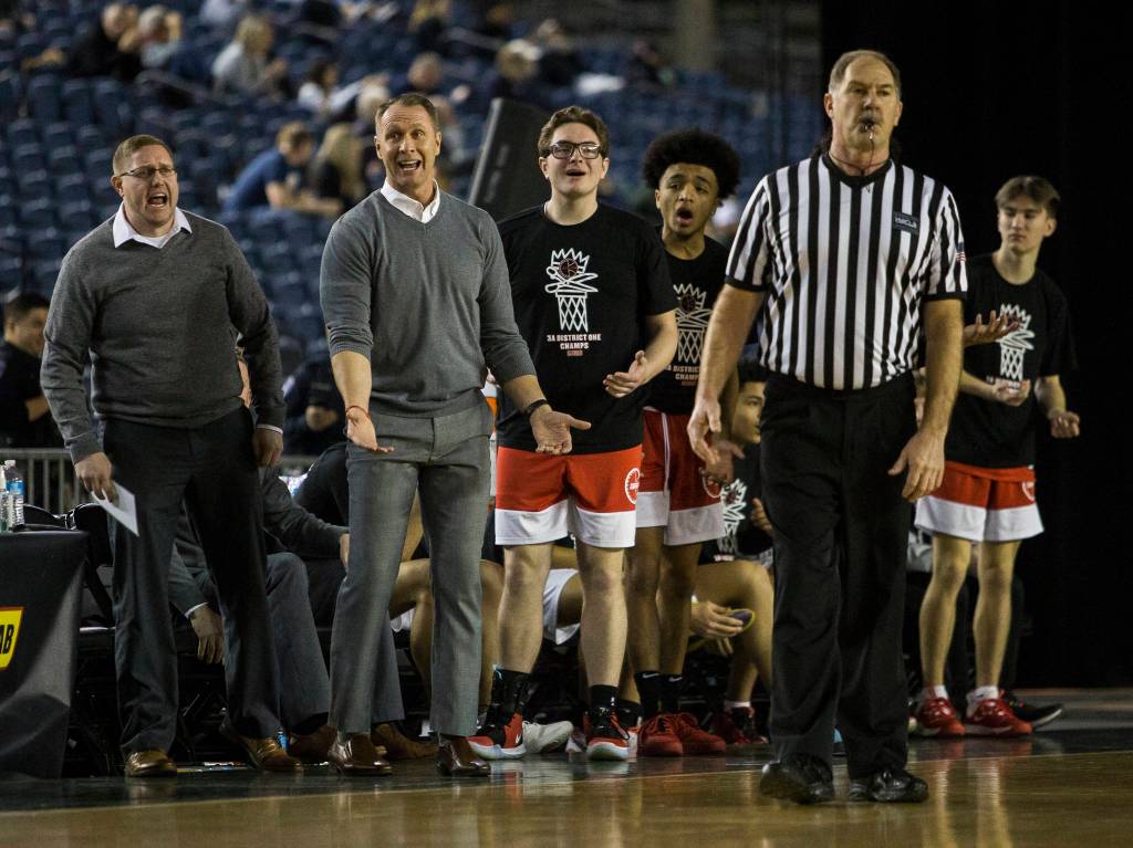 Marysville Pilchuck head coach Bary Gould complains to the referee about a call during a 3A boys Hardwood Classic quarterfinal against Garfield on Thursday in Tacoma. (Olivia Vanni / The Herald)