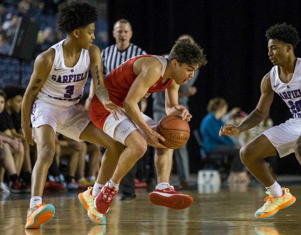 Marysville Pilchucks Brady Phelps reacts to being fouled by Garfields Koren Johnson during a 3A boys Hardwood Classic quarterfinal on Thursday in Tacoma. (Olivia Vanni / The Herald)