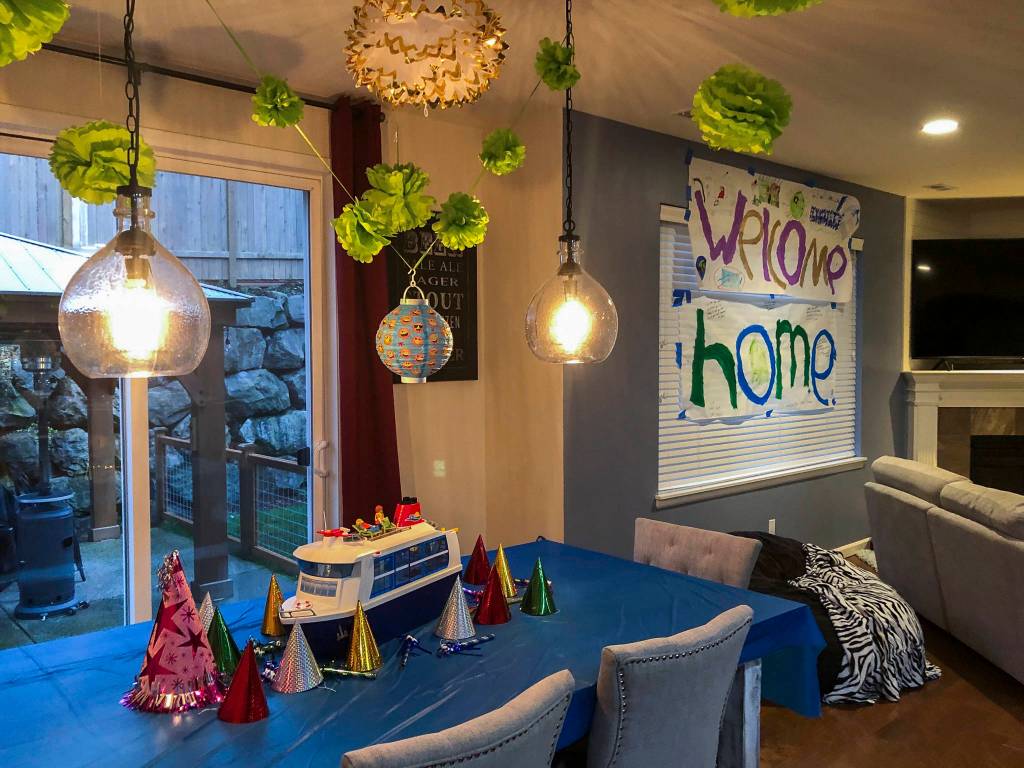 A poster, party hats and a toy cruise ship set up by Susan Anabels family welcomed her home. (Susan Anabel)