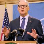Washington Gov. Jay Inslee talks to the media Tuesday in Olympia. (AP Photo/Rachel La Corte)