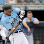 Seattle Mariners Tom Murphy pops out during the fourth inning against the Los Angeles Angels in a spring training baseball game March 10 in Peoria, Arizona. (AP Photo/Elaine Thompson)