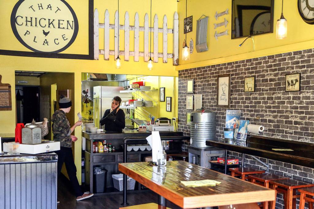 Brandy Wahlstrom, owner-operator of That Chicken Place, and her son, Zach Maychrak, work Saturday afternoon. (Kevin Clark / The Herald)