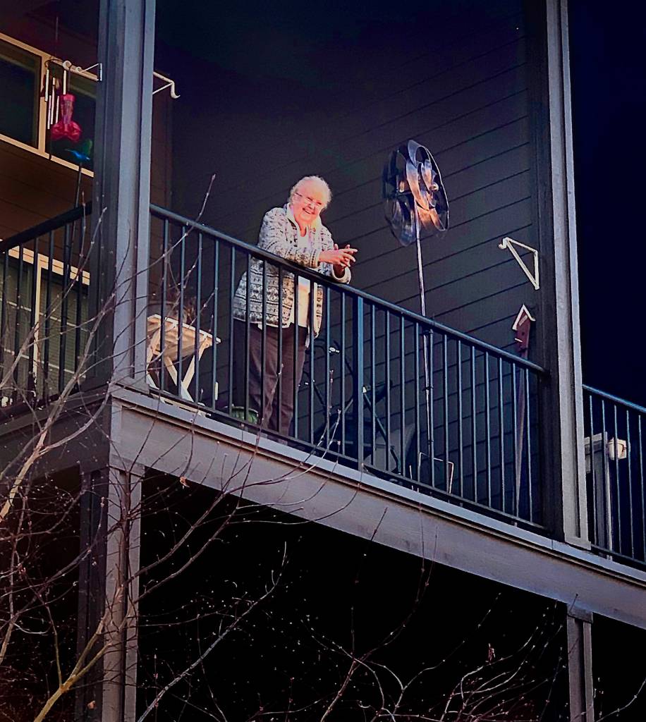 Photos courtesy of Vanessa Ross                                Carolyn Ross, on the balcony of her apartment at Arlingtons Olympic Place, was happily surprised on her 96th birthday Monday. Unable to visit the senior community due to coronavirus precautions, her children and their spouses sang Happy Birthday from outside.