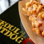 A deep-fried hot dog on a stick studded with french fries at Seoul Hotdog in Lynnwood. (Kevin Clark / Herald file)