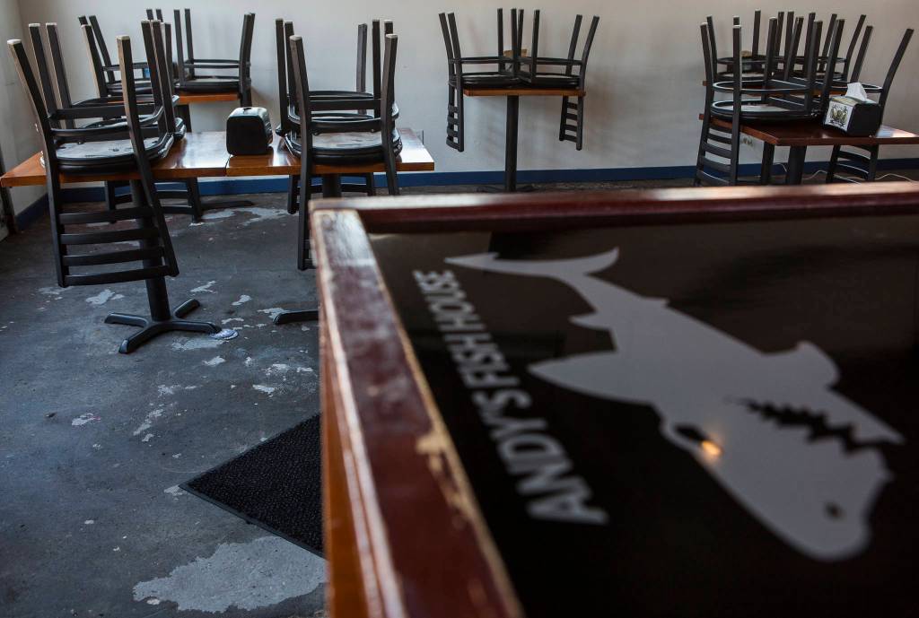 Chairs are stacked on tables in the dining area of Andys Fish House on Thursday in Snohomish. (Olivia Vanni / The Herald)