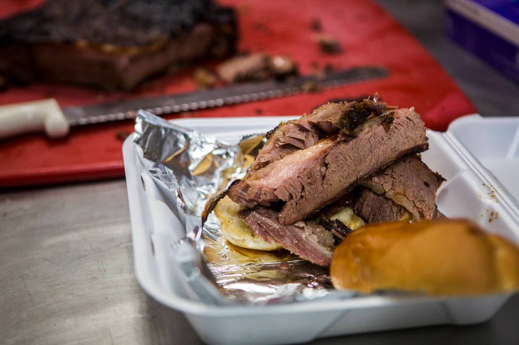 A brisket sandwich is ready for pick-up at Carolina Smoke in Bothell. (Olivia Vanni / The Herald)