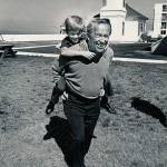 On a sunny day near Mukilteo Lighthouse Park, Peter enjoys a ride on his fathers back.