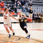 Mady Burdett of Whitman, a former Edmonds-Woodway High School standout, drives to the basket against a Wheaton defender during a game in the 2020 NCAA Division III womens basketball tournament. (Whitman College photo)