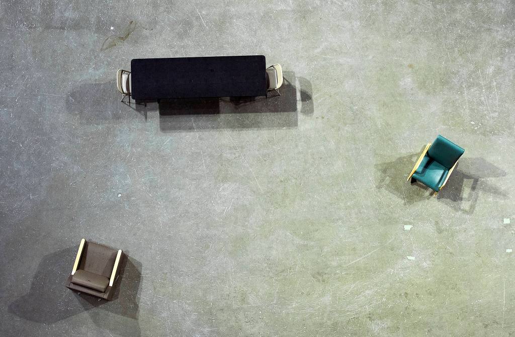 A table and chairs are set up with acceptable social distancing guidelines at the Angel of the Winds Arena on Tuesday. Both ice rinks are set up for those who need to quarantine and have no where else to go. (Andy Bronson / The Herald)