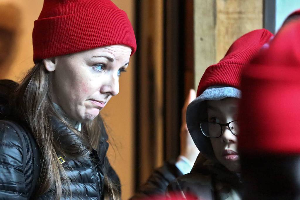 Jennie Warmouth leads her class to an exhibit of two grizzly bears at the Woodland Park Zoo. (Kevin Clark / The Herald)
