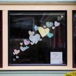 Paper hearts and a sign that says, thank you nurses are affixed to in a window of a home on Rucker Avenue in Everett. (Olivia Vanni / The Herald)