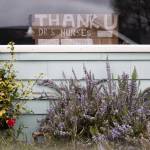 A sign with the phrase, thank u drs nurses and first responders sits on display in a window of a home along 15th Street on Friday in Everett. (Olivia Vanni / The Herald)