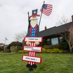 A wooden sign thanking essential workers sits in the front yard of a home along Hoyt Avenue on Friday in Everett. (Olivia Vanni / The Herald)