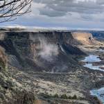 Rocks fall from the north side of the Snake River Canyon near Twin Falls, Idaho, during an earthquake Tuesday. (Israel Bravo via AP)
