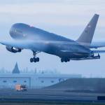 Condensation forms over the wings of a Boeing KC-46 Pegasus tanker as it takes off from Paine Field in Everett in 2019. (Andy Bronson / The Herald)