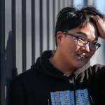 Daniel Han, a resident assistant, at Everett Community Colleges Mountain View Hall. (Kevin Clark / The Herald)