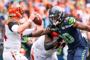 Seattle defensive end Jadeveon Clowney, currently a free agent, rushes Cincinnati quarterback Andy Dalton in the Seahawks 21-20 victory on Sept. 8 at CenturyLink Field. (Kevin Clark / The Herald)