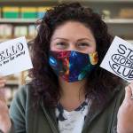 Cat Snapp shows off two of her downloadable cards in her studio in Everett. The cards print in black and white, so the customer can color them in themselves. (Andy Bronson / The Herald)