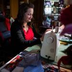Nikki Speaks works on a handful of new masks at her home on April 10 in Woodinville. (Olivia Vanni / The Herald)