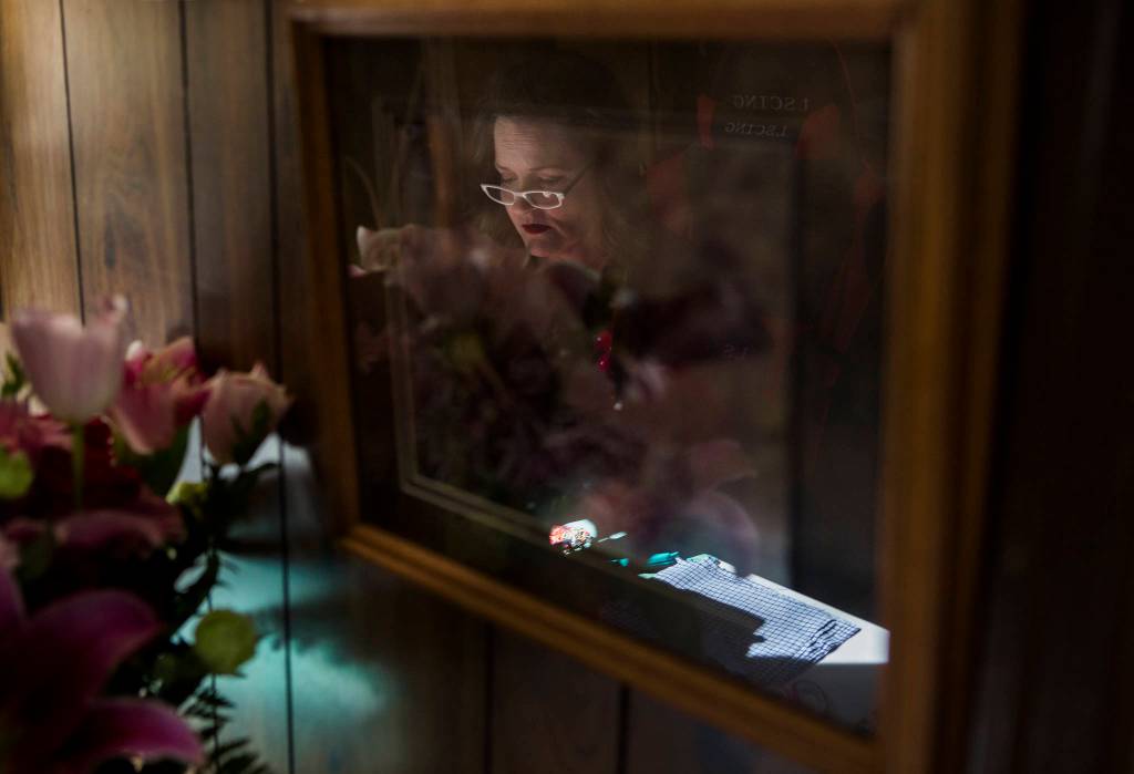 Nikki Speaks works on masks at her home on April 10 in Woodinville. (Olivia Vanni / The Herald)