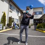 Michael ODonnell, 81, catches a football Tuesday as he throws around with staff and residents of the Sunrise View Retirement and Rehabilitation Center in Everett. (Andy Bronson / The Herald)
