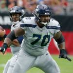 Seahawks offensive guard Mike Iupati (70) block for quarterback Russell Wilson (background) during a game against the Cardinals on Sept. 29, 2019, in Glendale, Ariz. (AP Photo/Rick Scuteri)