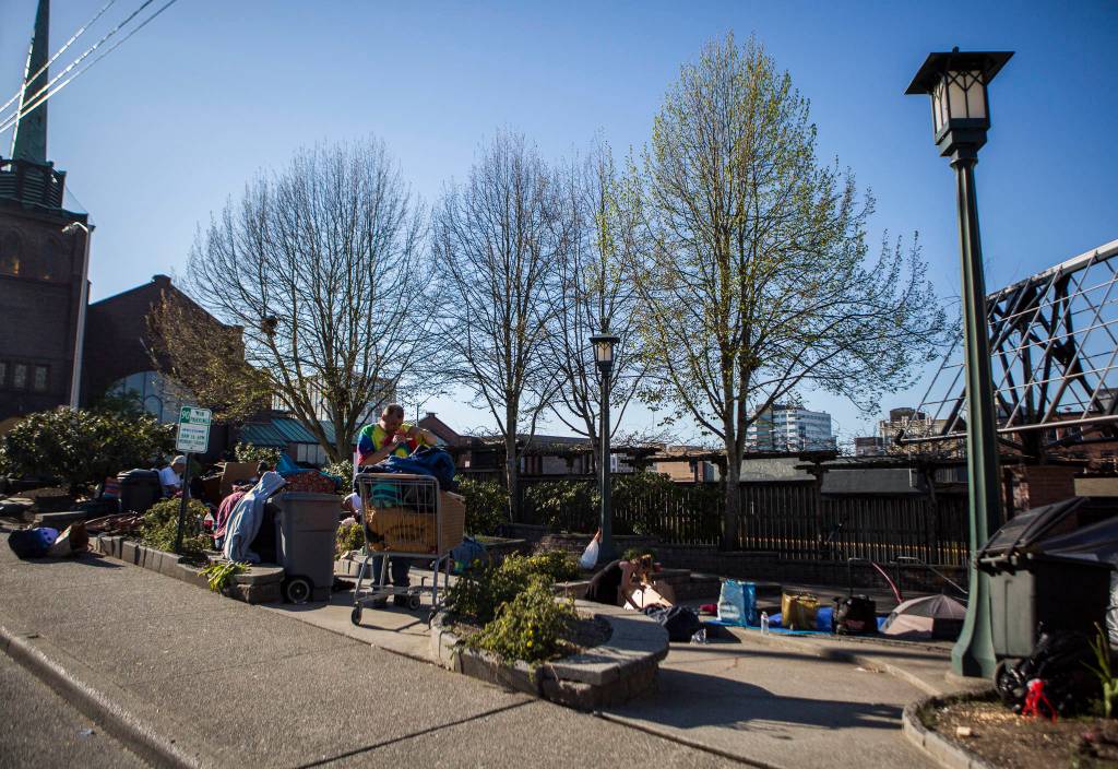 People convene at Matthew Parsons Park at a homeless camp on Monday in Everett. (Olivia Vanni / The Herald)