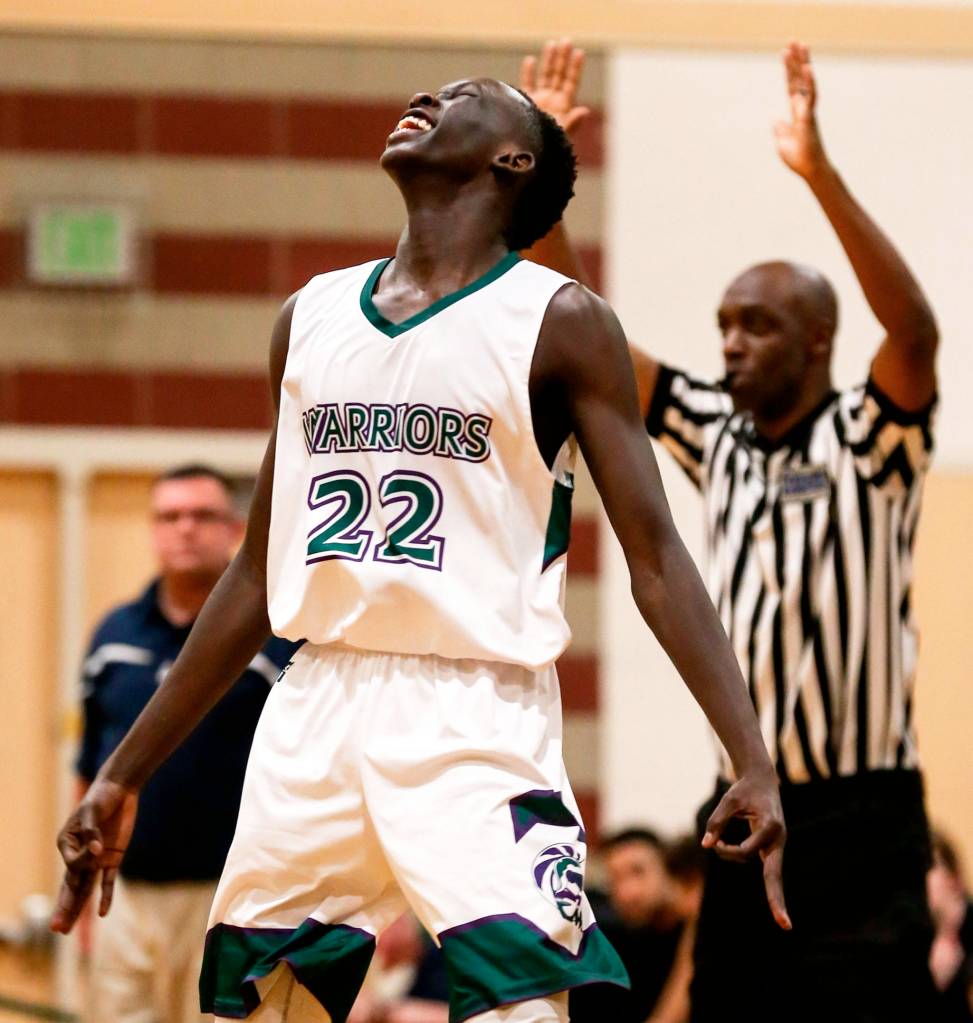 Edmonds-Woodways Mutdung Bol celebrates his 3-pointer against Arlington on Jan. 9, 2019, at Edmonds-Woodway High School. (Kevin Clark / Herald file)