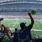 Fans at CenturyLink Field cheer at the start of an NFL game between the Seahawks and Bengals on Sept. 8, 2019, in Seattle. (AP Photo/Stephen Brashear)