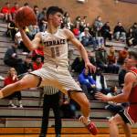 Mountlake Terrace guard Mason Christianson looks to pass during a Jan. 10 game against Stanwood at Mountlake Terrace High School. (Kevin Clark / The Herald)