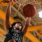 Arlingtons Will Abram dunks during a game at Edmonds-Woodway High School on Jan. 9, 2019. (Kevin Clark / The Herald)