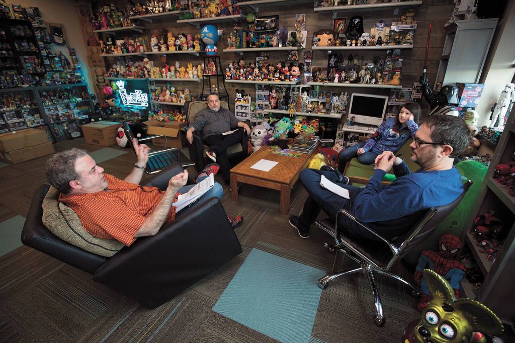 Surrounded by the companys products, Funko Creative Director Sean Wilkinson (left) meets before the coronavirus shutdown with (from left) Eddie Iziarry, Darcy Harlen and Gary Ham. (Andy Bronson / The Herald)