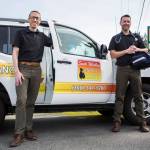 South Whidbey Animal Clinic veterinarians Dr. Rob Jung, left, and Dr. Eric Patrin with their pet ambulance in Clinton. (Olivia Vanni / The Herald)