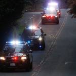 Gary Locke, a QFC worker for 11 years well known for his friendly service, is honored as a frontline hero in a nightly parade on 53rd Avenue West in Mukilteo. (Kevin Clark / The Herald)
