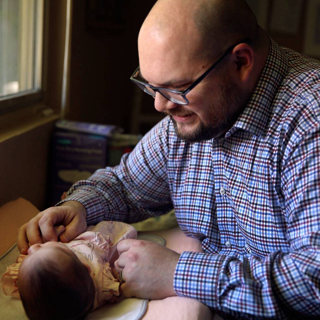 Charlotte Diane Miller with father Josh Miller was born on April 11 at Providence Pavilion for Women and Children because Swedish Edmonds baby unit was closed due to COVID-19. (Kevin Clark / The Herald)