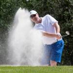 Jacob Rohde hits out of the bunker on the second hole during the final day of the Snohomish County Amateur golf tournament in 2018 at Walter Hall Golf Course in Everett. (Andy Bronson / The Herald)